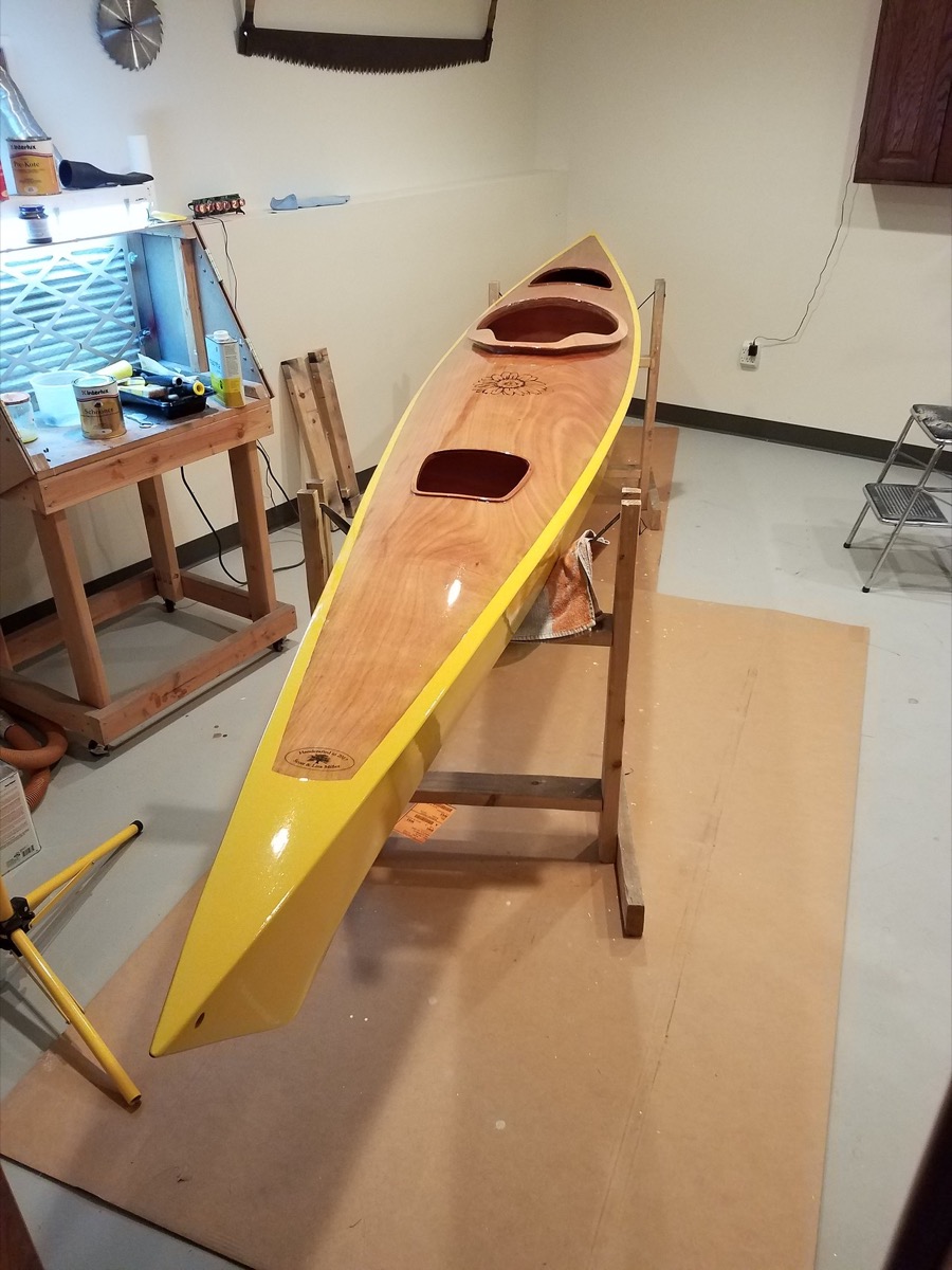 Yellow 16 foot sea kayak with daisy emblem